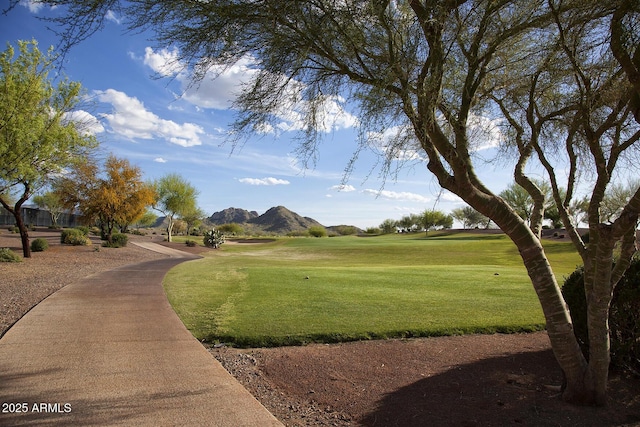26421 W Zachary Dr, Buckeye, AZ 85396 - view of property's community with a mountain view, view of golf course, and a lawn