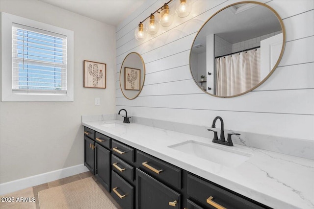 2466 E Harrison Ct, Gilbert, AZ 85295 - full bathroom featuring double vanity, baseboards, tile patterned floors, and curtained shower