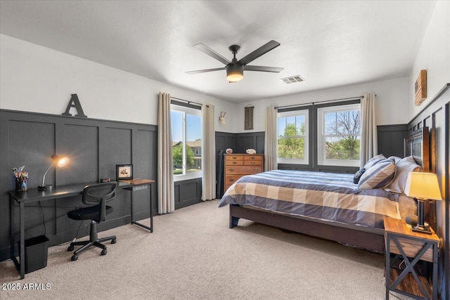 2466 E Harrison Ct, Gilbert, AZ 85295 - carpeted bedroom with multiple windows, an office area, ceiling fan, and wainscoting