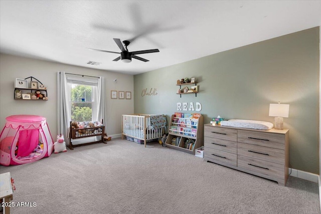2466 E Harrison Ct, Gilbert, AZ 85295 - carpeted bedroom with a nursery area, baseboards, and ceiling fan