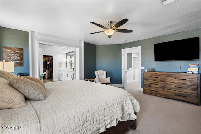 2466 E Harrison Ct, Gilbert, AZ 85295 - carpeted bedroom featuring a spacious closet, connected bathroom, baseboards, ceiling fan, and a closet