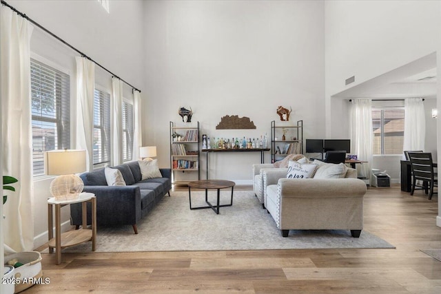 2466 E Harrison Ct, Gilbert, AZ 85295 - living room with a towering ceiling and wood finished floors