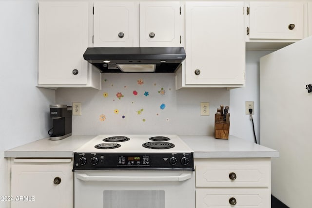 kitchen featuring white range with electric cooktop and white cabinetry