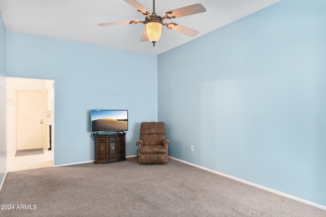 unfurnished room with light carpet and ceiling fan