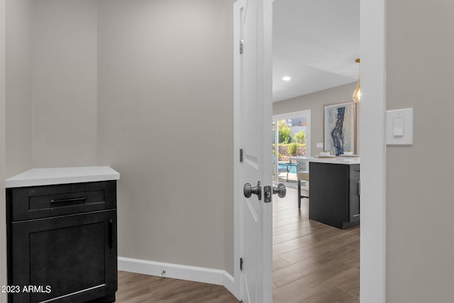 corridor featuring light hardwood / wood-style floors