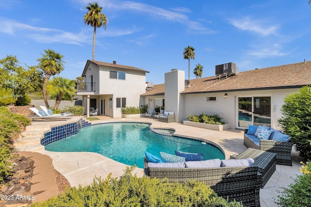 view of pool with a patio area, outdoor lounge area, and cooling unit