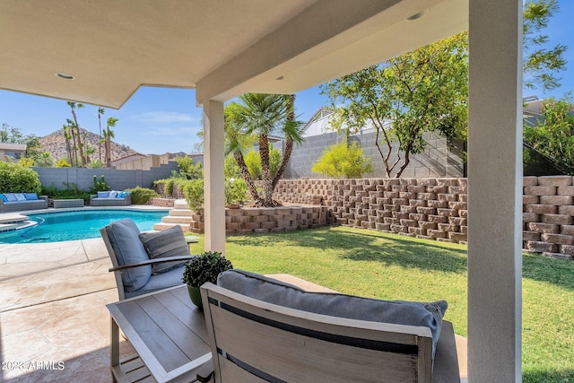 view of patio / terrace featuring a fenced in pool