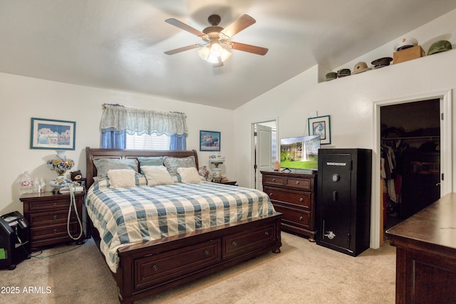 bedroom featuring light carpet, a walk in closet, a ceiling fan, vaulted ceiling, and a closet