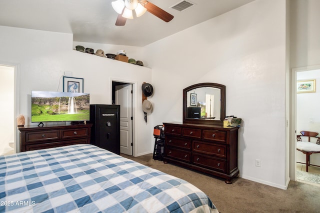 bedroom with ceiling fan, visible vents, vaulted ceiling, carpet floors, and baseboards