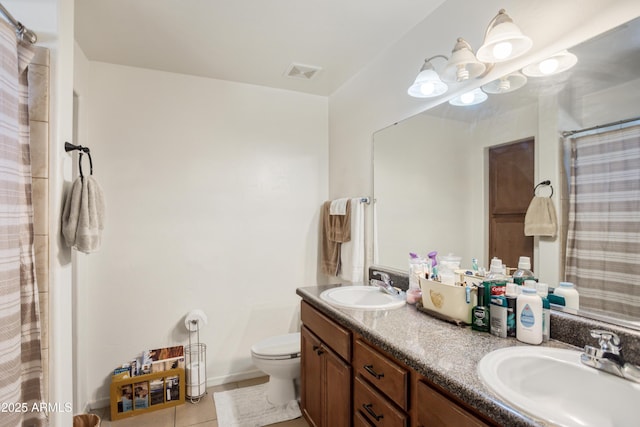 full bath with double vanity, toilet, tile patterned floors, and a sink