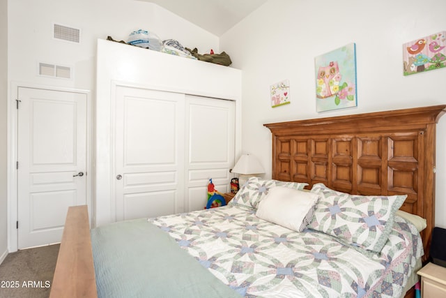 carpeted bedroom with a closet and visible vents
