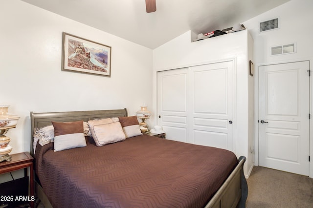 carpeted bedroom with ceiling fan, visible vents, and a closet