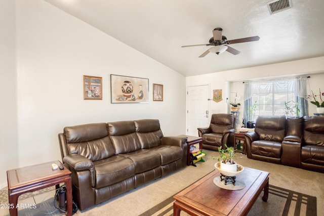 living area featuring carpet floors, a ceiling fan, lofted ceiling, and visible vents