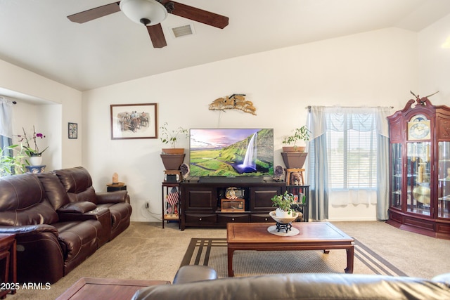 living room featuring carpet floors, a ceiling fan, lofted ceiling, and visible vents
