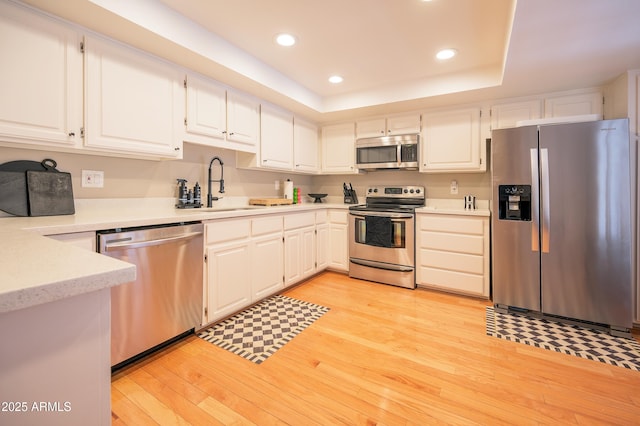 5102 N 31st Pl Unit 432, Phoenix, AZ 85016 - kitchen with light wood-style flooring, a sink, stainless steel appliances, light countertops, and recessed lighting