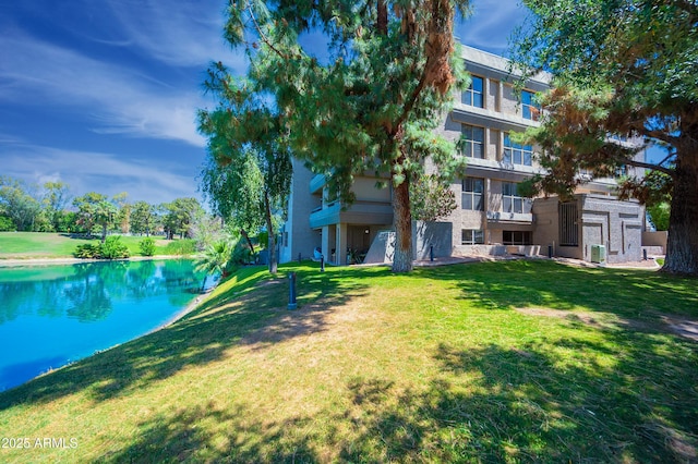 5102 N 31st Pl Unit 432, Phoenix, AZ 85016 - view of swimming pool with a water view and a yard