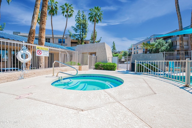 5102 N 31st Pl Unit 432, Phoenix, AZ 85016 - view of pool with a gate, fence, and a community hot tub