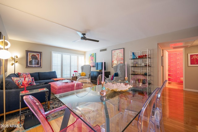 5102 N 31st Pl Unit 432, Phoenix, AZ 85016 - dining space featuring baseboards, visible vents, wood finished floors, and a ceiling fan