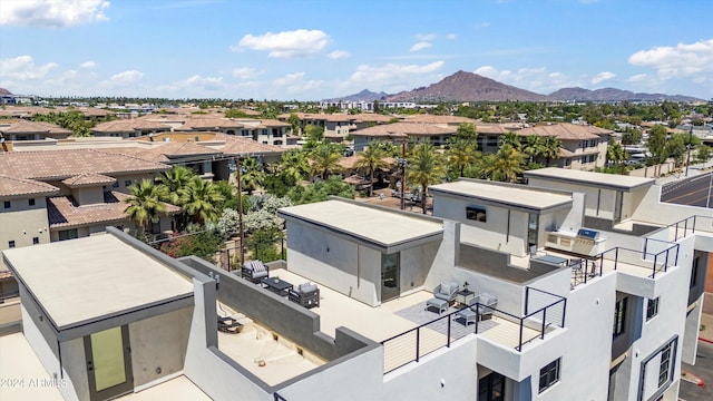 birds eye view of property featuring a mountain view