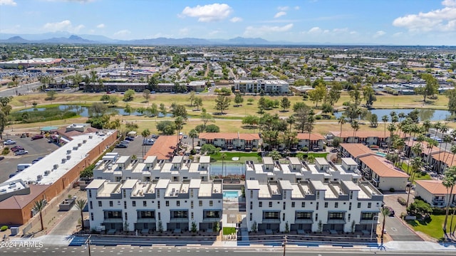 birds eye view of property featuring a water and mountain view