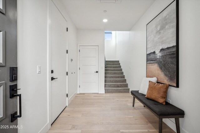 living room with light wood-type flooring and a healthy amount of sunlight