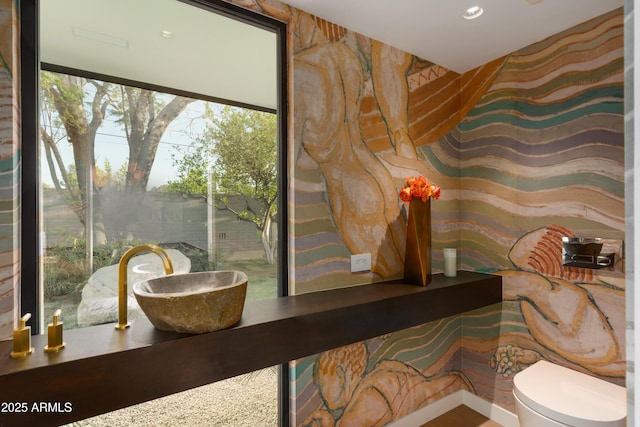 interior space featuring recessed lighting and toilet
