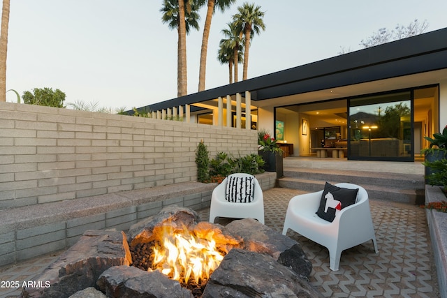 view of patio / terrace featuring fence and an outdoor fire pit