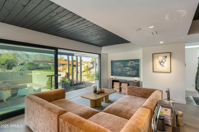 dining area with recessed lighting, baseboards, and wood finished floors