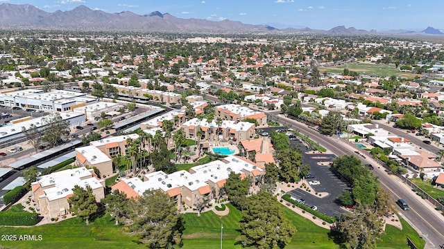 drone / aerial view featuring a residential view and a mountain view