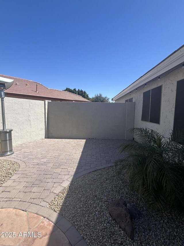 view of patio with fence