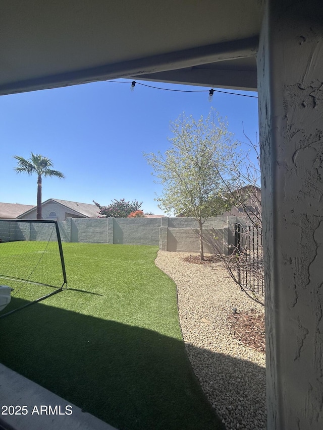 view of yard featuring a fenced backyard