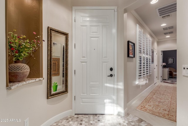 corridor with crown molding and light tile patterned flooring