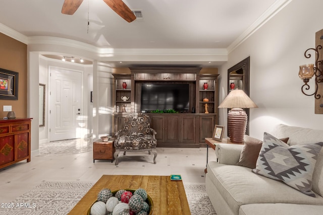 living room with rail lighting, ceiling fan, and ornamental molding