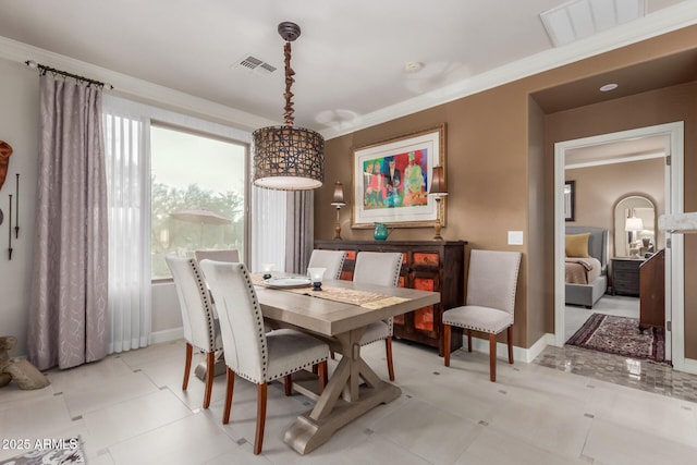 dining space with ornamental molding