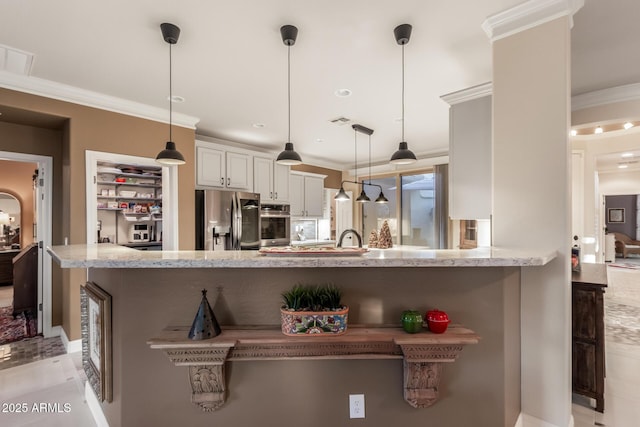 kitchen featuring white cabinets, crown molding, appliances with stainless steel finishes, decorative light fixtures, and kitchen peninsula