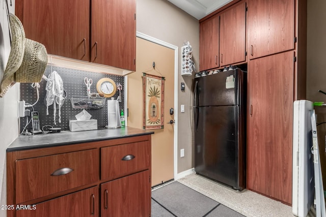 kitchen with black fridge