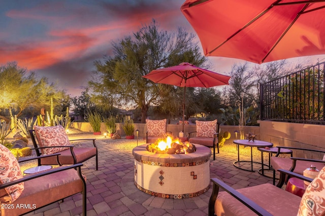 patio terrace at dusk with a fire pit