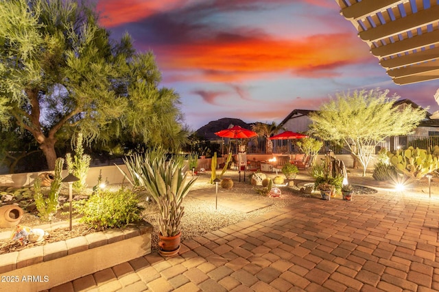 view of patio terrace at dusk