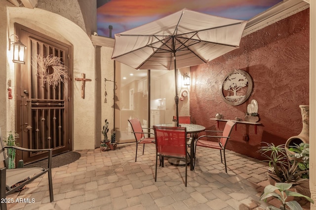 view of patio terrace at dusk