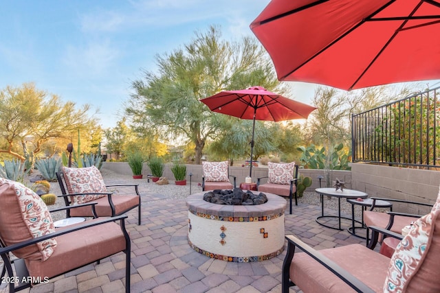 view of patio with a fire pit