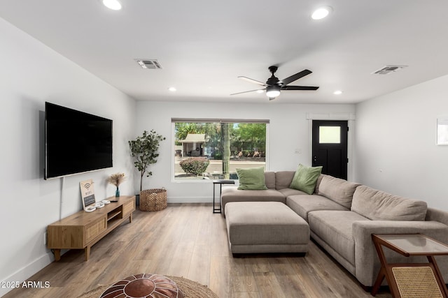 8547 E Roanoke Ave, Scottsdale, AZ 85257 - living area with wood finished floors, visible vents, and recessed lighting