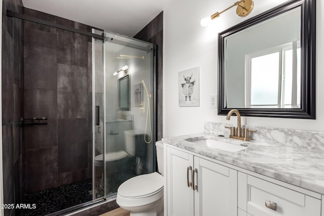 8547 E Roanoke Ave, Scottsdale, AZ 85257 - bathroom featuring toilet, vanity, and a stall shower