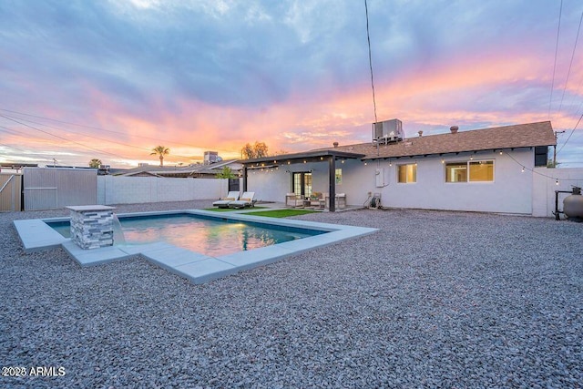 8547 E Roanoke Ave, Scottsdale, AZ 85257 - view of pool featuring central AC, a patio area, a fenced backyard, an outbuilding, and a fenced in pool