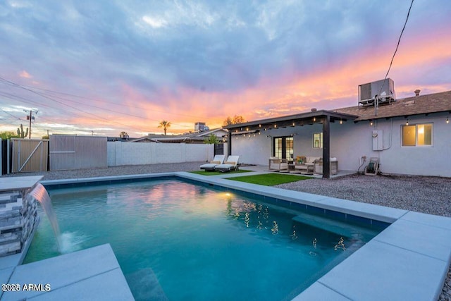 8547 E Roanoke Ave, Scottsdale, AZ 85257 - view of pool featuring a patio area, a fenced backyard, outdoor lounge area, and central AC unit