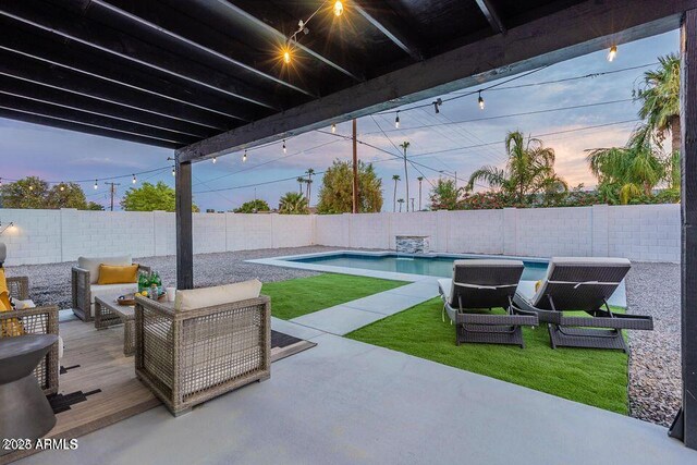8547 E Roanoke Ave, Scottsdale, AZ 85257 - patio terrace at dusk with a fenced backyard, a wooden deck, a yard, and a fenced in pool