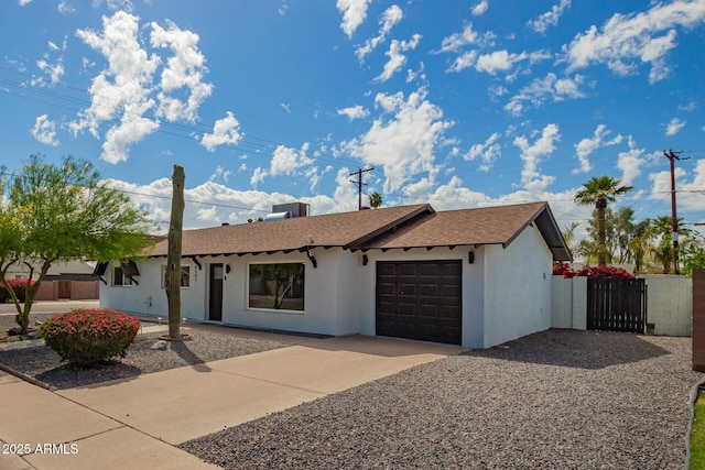 8547 E Roanoke Ave, Scottsdale, AZ 85257 - single story home with an attached garage, concrete driveway, a gate, and stucco siding