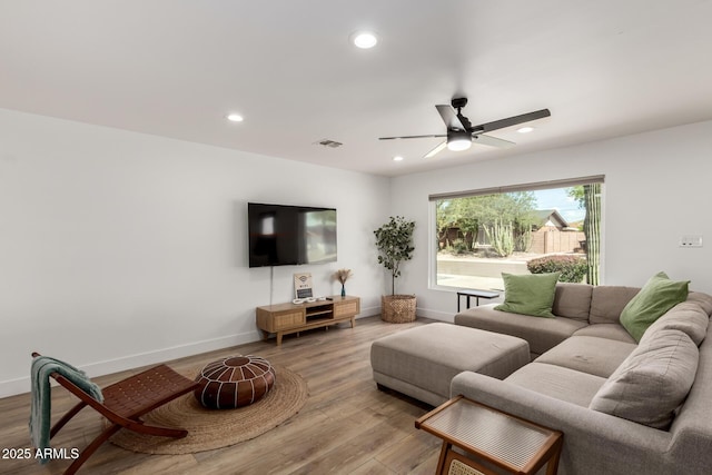 8547 E Roanoke Ave, Scottsdale, AZ 85257 - living room with a ceiling fan, light wood-style floors, baseboards, visible vents, and recessed lighting