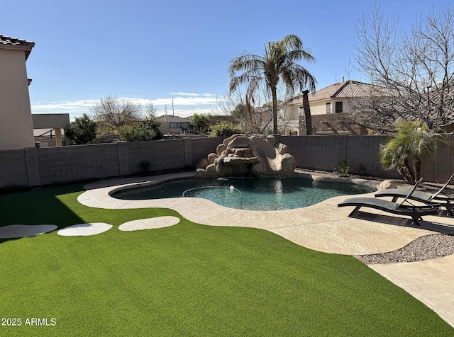 view of pool featuring pool water feature, a yard, and a patio area