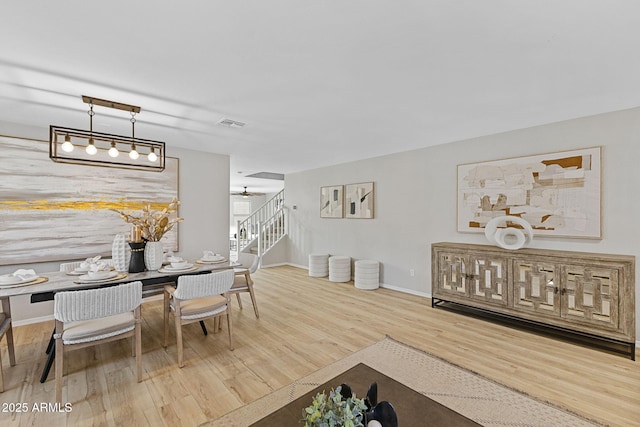 dining area with hardwood / wood-style floors