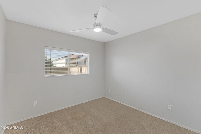 spare room with ceiling fan and carpet flooring